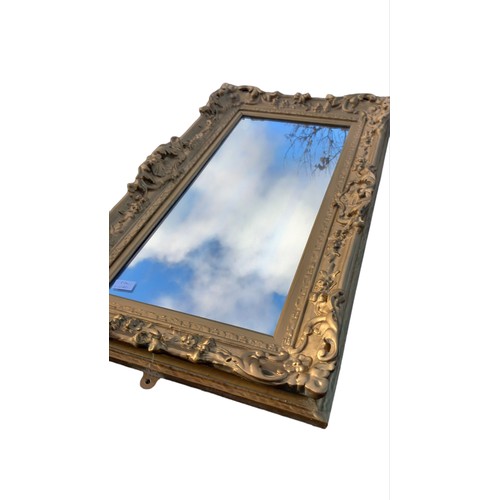 180A - AN ORNATE VICTORIAN WALL HANGING MIRROR