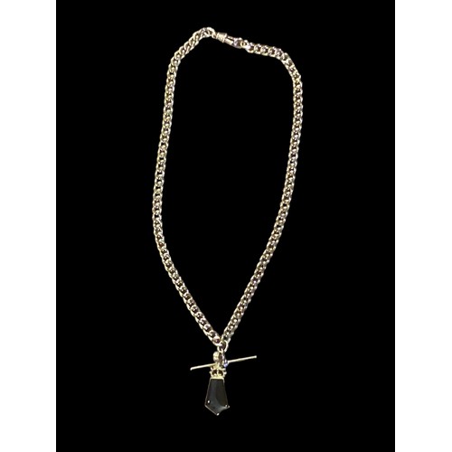 648 - A HEAVY 9CT GOLD CURB LINK CHAIN WITH A T.BAR WITH A DOUBLE SIDED PENDANT SET WITH MOTHER OF PEARL &... 