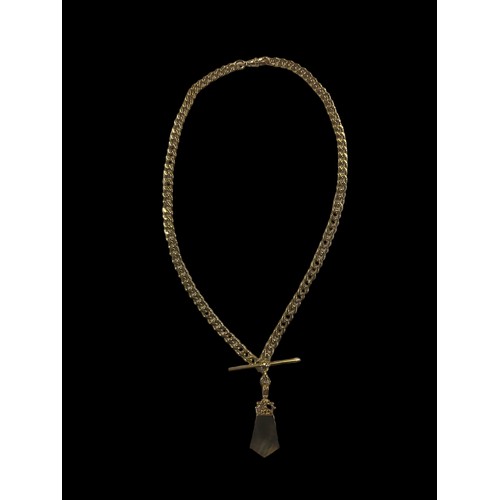 648 - A HEAVY 9CT GOLD CURB LINK CHAIN WITH A T.BAR WITH A DOUBLE SIDED PENDANT SET WITH MOTHER OF PEARL &... 