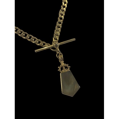 648 - A HEAVY 9CT GOLD CURB LINK CHAIN WITH A T.BAR WITH A DOUBLE SIDED PENDANT SET WITH MOTHER OF PEARL &... 