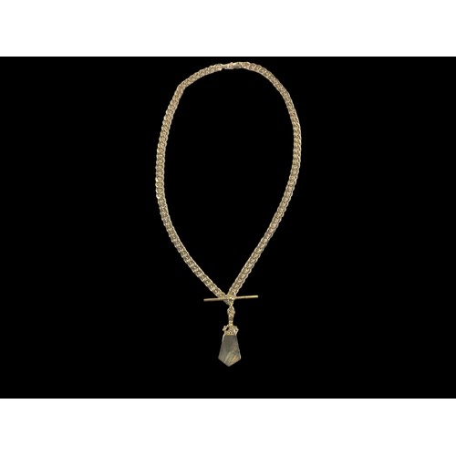 648 - A HEAVY 9CT GOLD CURB LINK CHAIN WITH A T.BAR WITH A DOUBLE SIDED PENDANT SET WITH MOTHER OF PEARL &... 