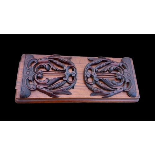 796 - A BEAUTIFULLY CARVED ANTIQUE WALNUT BOOKSLIDE