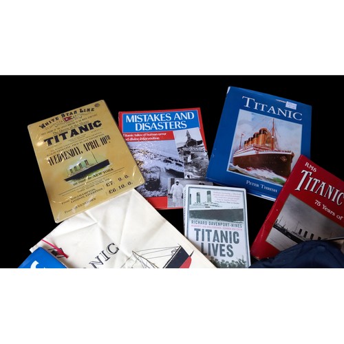 26 - QTY OF TITANIC MEMORABILIA BOOKS,T-SHIRTS ETC