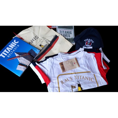 26 - QTY OF TITANIC MEMORABILIA BOOKS,T-SHIRTS ETC