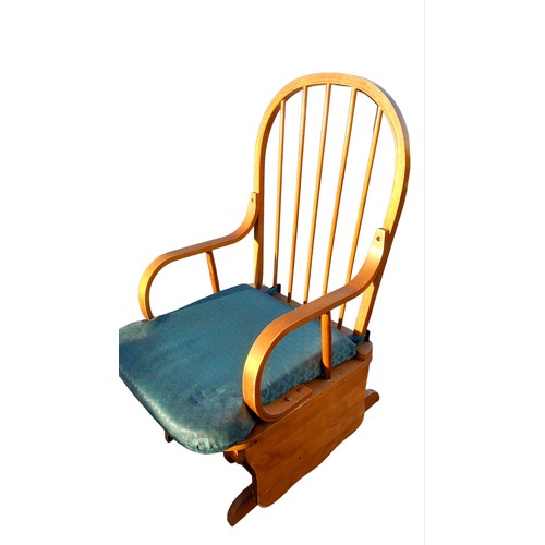 48 - A GLIDING ROCKING CHAIR AND MATCHING STOOL