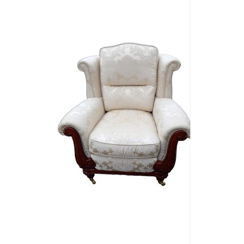 142 - A PATTERNED WINGBACK ARMCHAIR