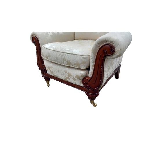 142 - A PATTERNED WINGBACK ARMCHAIR