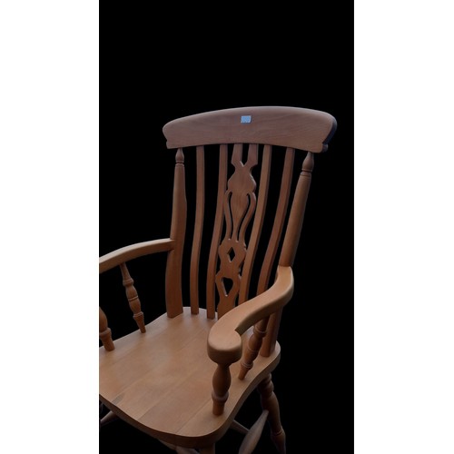 146 - A GOOD QUALITY PINE ARMCHAIR WITH SLAT BACK