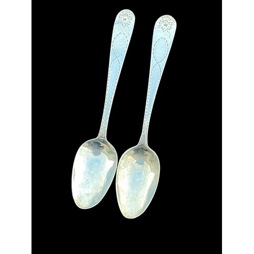 494 - A PAIR OF ORNATE HANDLED IRISH SILVER TEASPOON 22.55grm