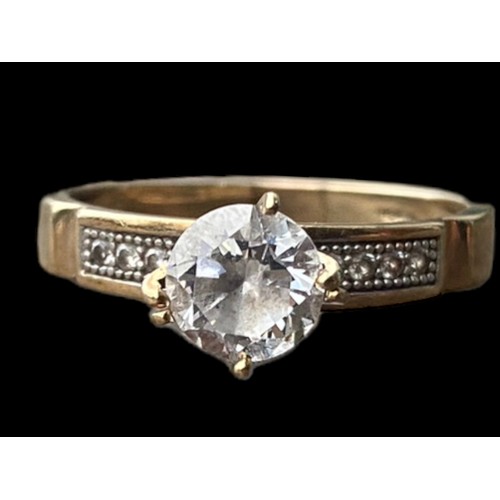 503 - 10k GOLD SOLITAIRE RING WITH STONE SET SHOULDERS SIZE R