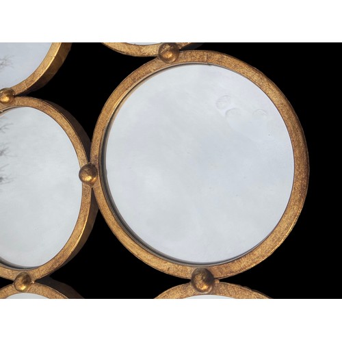 150 - A NEW 9 CIRCULAR PANEL GILT MIRROR