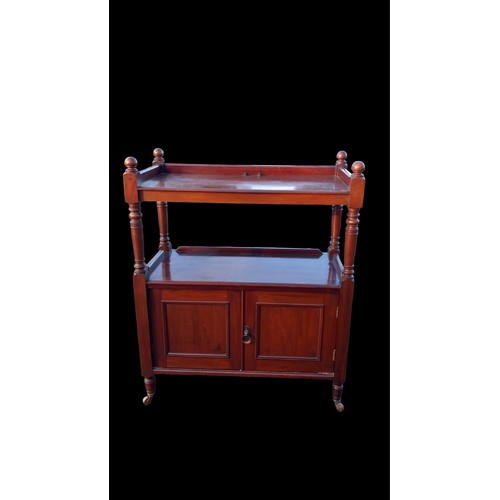 151 - AN ANTIQUE MAHOGANY DUMB WAITER ON CASTORS