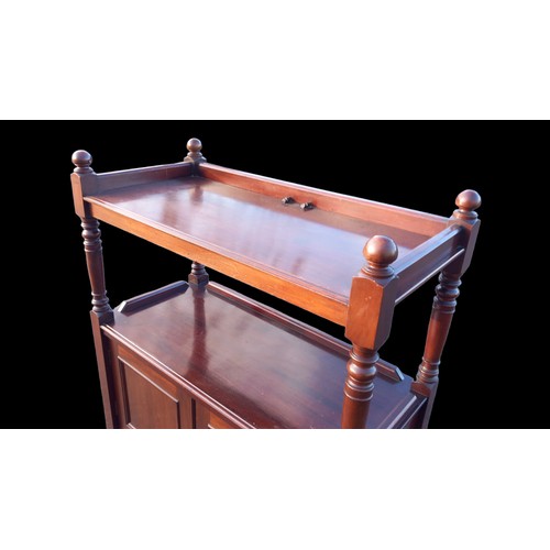 151 - AN ANTIQUE MAHOGANY DUMB WAITER ON CASTORS