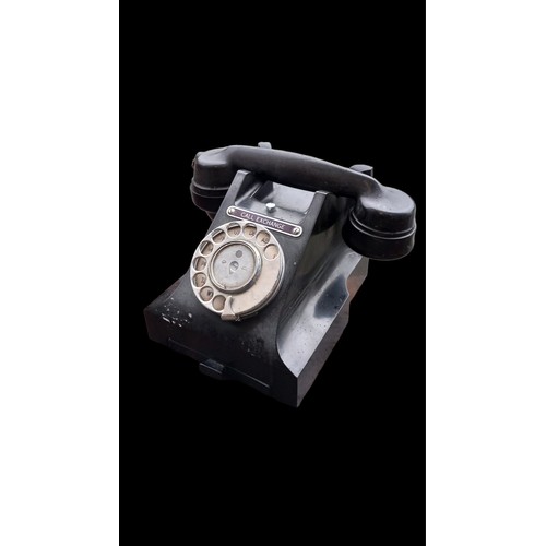 155 - A REPRODUCTION CLOCK & A VINTAGE TELEPHONE IN BLACK