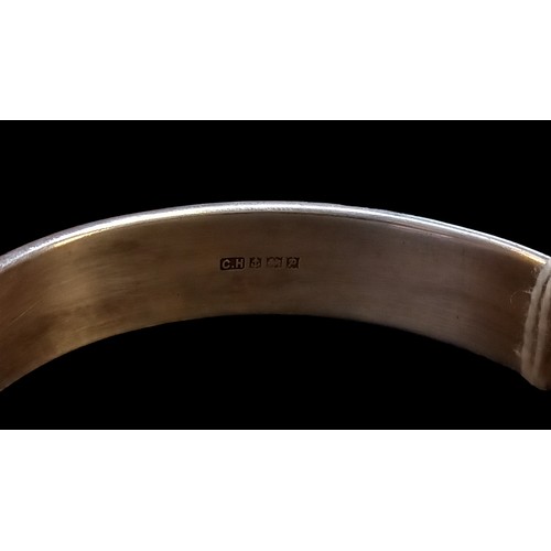 207 - A SILVER HINGED BANGLE