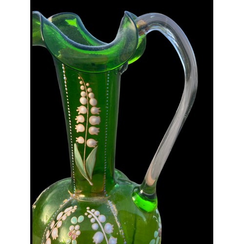 223 - A STUNNING HAND PAINTED FRILLED GREEN GLASS JUG 8.5