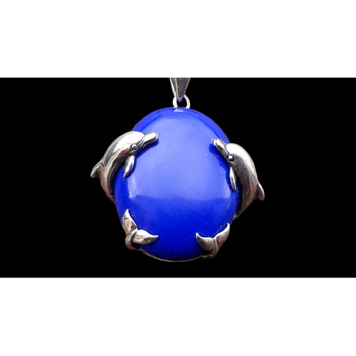 224 - A SILVER MOUNTED DOLPHIN PENDANT SET WITH A BLUE LAPIS ON SILVER CHAIN