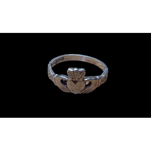 236 - A SILVER CLADDAGH RING