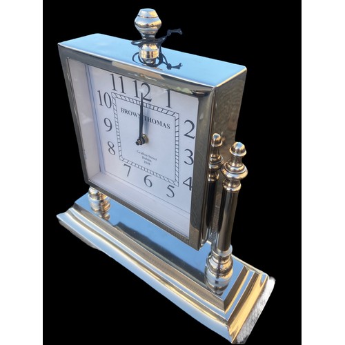 102 - A CHROME MANTLE CLOCK ON STAND