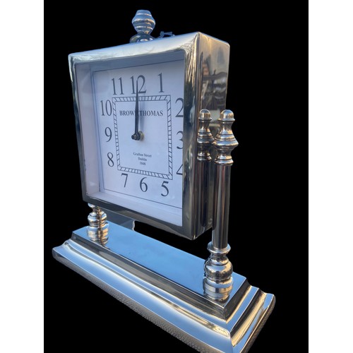 102 - A CHROME MANTLE CLOCK ON STAND