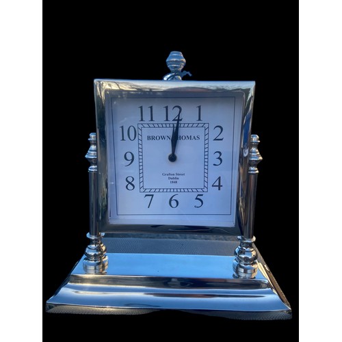 102 - A CHROME MANTLE CLOCK ON STAND