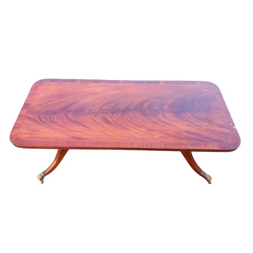 121 - FLAME MAHOGANY COFFEE TABLE WITH BRASS CASTORS