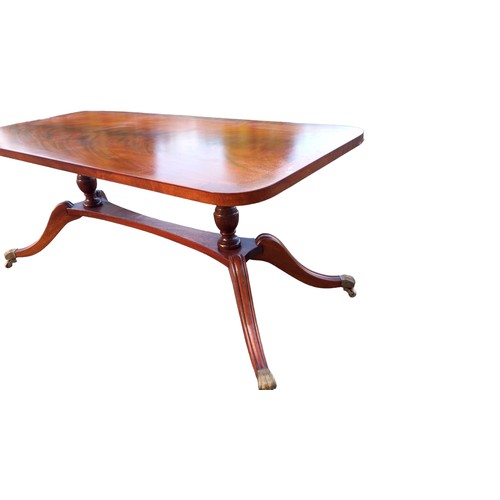 121 - FLAME MAHOGANY COFFEE TABLE WITH BRASS CASTORS