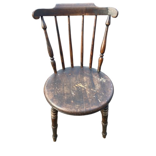 128 - AN ANTIQUE SPIDDLE BACKED CHAIR WITH A STRECHER BASE HAS HAD WORM