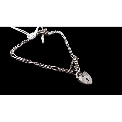 274 - A SILVER CHARM BRACELET WITH HEART PADLOCK CATCH & A BALLERINA CHARMS