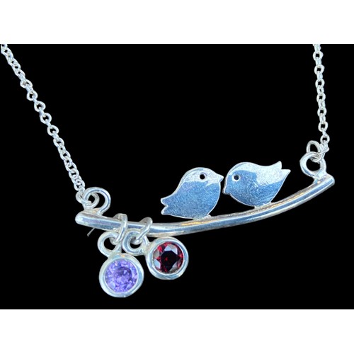 283 - A LARGE SILVER LOVE BIRDS NECKLACE SET WITH AMETHYST AND GARNET