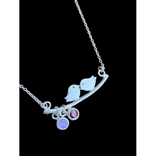 283 - A LARGE SILVER LOVE BIRDS NECKLACE SET WITH AMETHYST AND GARNET