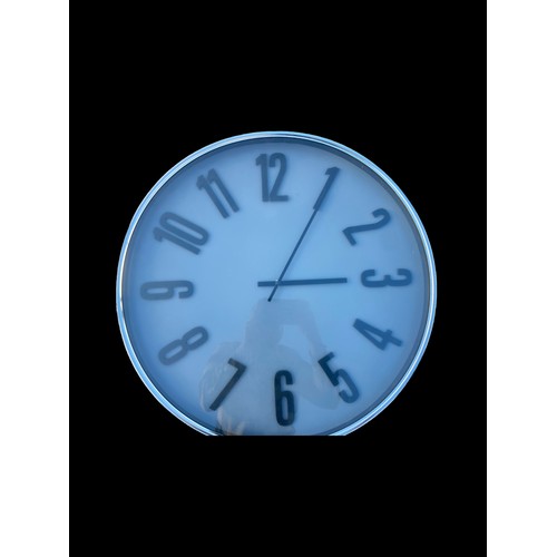 316 - A NEW GREY FACED CLOCK WITH A SILVER TRIM