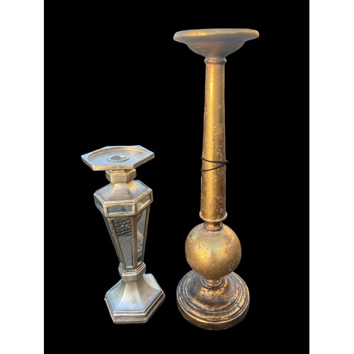 329 - A NEW SILVER FINISHED MIRRORED CANDLESTICK AND A GILT FINISHED CANDLE HOLDER