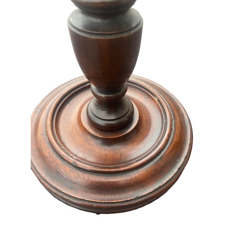 362 - A PAIR OF HAND TURNED REIDED MAHOGANY CANDLESTICKS