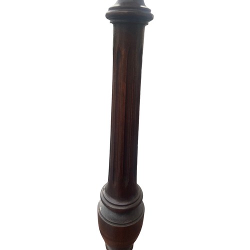 362 - A PAIR OF HAND TURNED REIDED MAHOGANY CANDLESTICKS