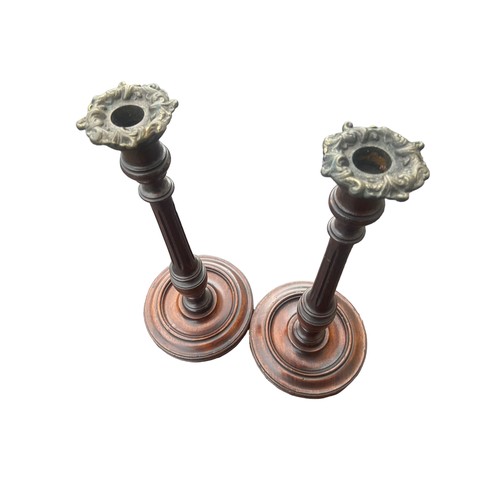 362 - A PAIR OF HAND TURNED REIDED MAHOGANY CANDLESTICKS