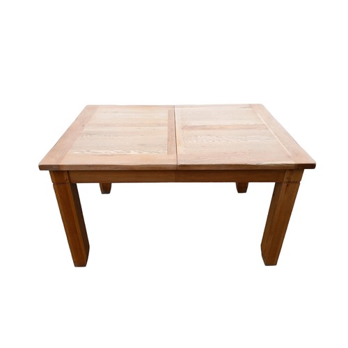 393 - A SOLID OAK EXTENDING DINING TABLE MEASURES