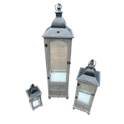 403 - A NEW SET OF 3 GRADUATED GREY FINISH CANDLE LANTERNS 2 OF WHICH HAVE DRAWRS TALLEST 48