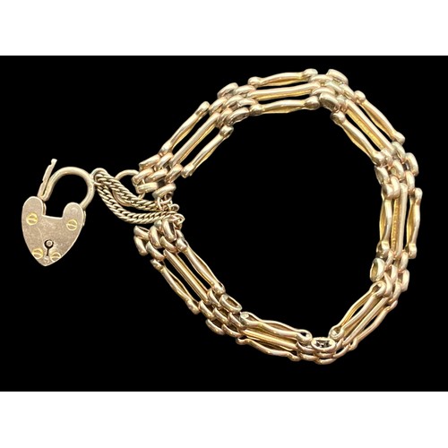 548 - A 9ct ROSE GOLD GATE BRACELET (3 BAR) WITH PADLOCK AND SAFETY CHAIN AND  13.9grm