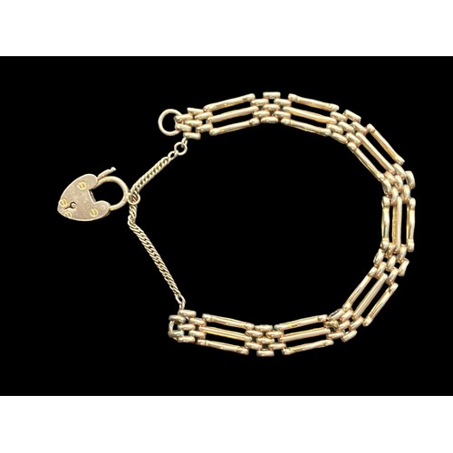 548 - A 9ct ROSE GOLD GATE BRACELET (3 BAR) WITH PADLOCK AND SAFETY CHAIN AND  13.9grm