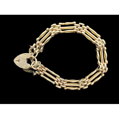 548 - A 9ct ROSE GOLD GATE BRACELET (3 BAR) WITH PADLOCK AND SAFETY CHAIN AND  13.9grm