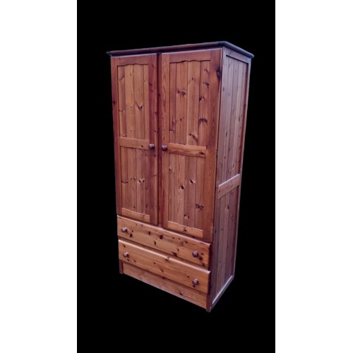 645 - A PINE DOUBLE ROBE WITH DRAWERS