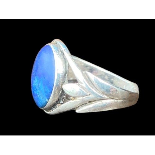 211A - AN ORNATE SILVER RING WITH A BLUE LAPIS STONE