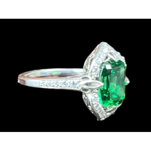 215A - A SILVER GEM SET EMERALD STYLE RING