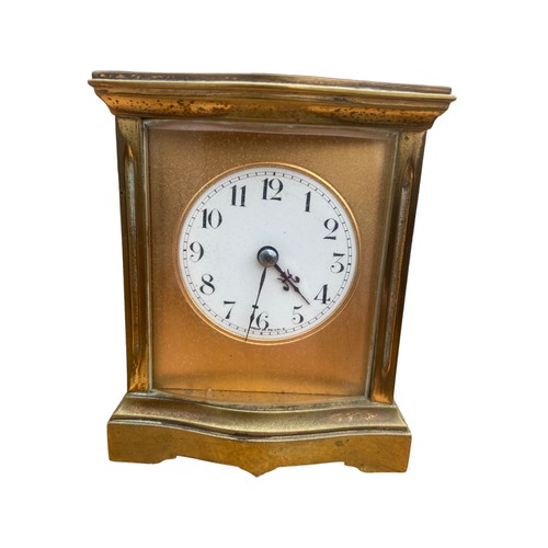 151 - A FRENCH BRASS CLOCK WITH BEVELLED GLASS APPROX 3.5