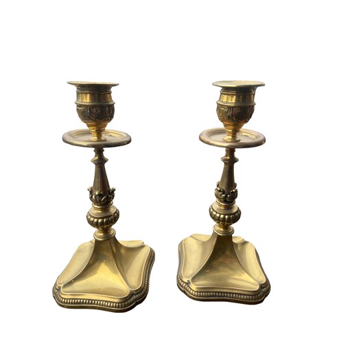 56 - A PAIR OF ORNATE SHAPED HEAVY BRASS CANDLESTICKS 7.5