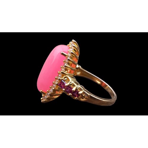 198 - UNUSAL PINK STONE SILVER GILT RING SET WITH MIXED GEMS