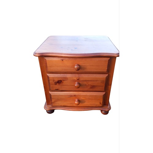 304 - A PINE 3 DRAWERED BEDSIDE