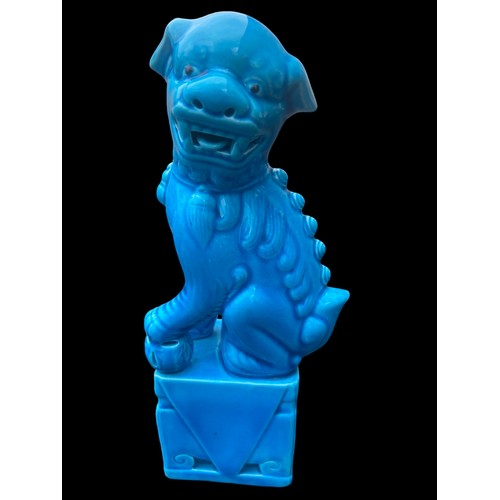 336 - A PAIR OF BLUE GLAZED POTTERY FOO DOGS WITH MARKINGS APPROX 8