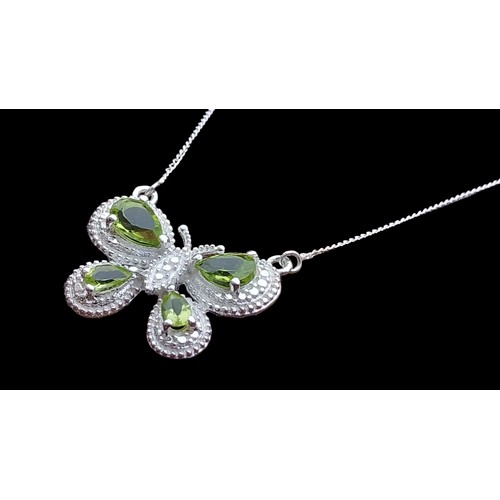 383 - A SILVER PERIDOT BUTTERFLY NECKLACE